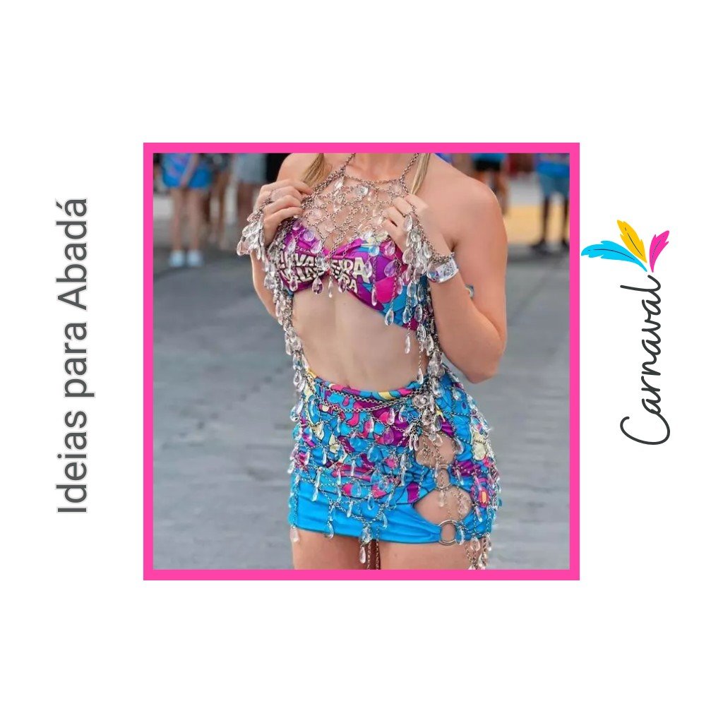 Ideias para Abadá de carnaval, com uma mulher usando um abadá customizado com top e saia coloridos e adornos com correntes e cristais.